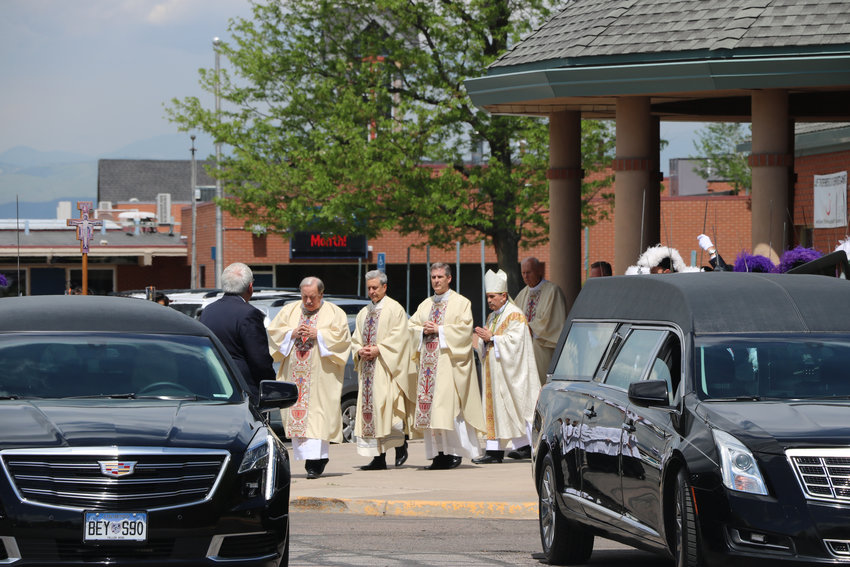 Bishops at St. Mary Catholic Parish in Littleton lead the Castillos out of the church following the May 17 funeral of their son, Kendrick Castillo.